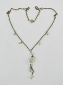 A silver pearl and green quartz necklace