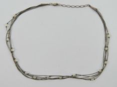 A silver and crystal Native American Nav