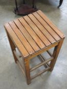 A pine stool having slatted seat, 35 x 3