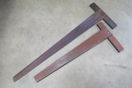 Two architects squares, one bearing labe