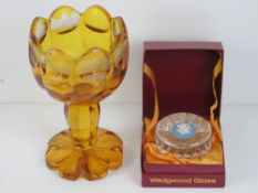 An amber glass goblet having etched Germ