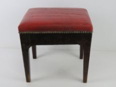 A footstool upholstered in red leather 3
