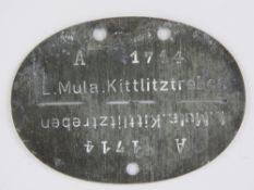 A WWII German dog tag for L Mula Luftwaffe.