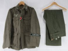 A replica WWII German Combat Tunic and Trousers (XL).