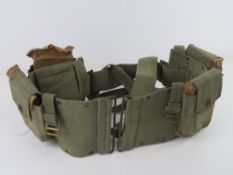 A BAR magazine belt with four BAR magazines.