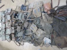Fifty assorted cold war era magazine pouches, loader bags, breech covers.