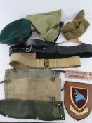 A quantity of assorted militaria; 2x British WWII Commando Cap. 1x pair British WWII Gaiters size 2.
