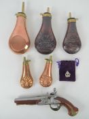 A replica flintlock pistol together with five contemporary powder horns.