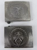 Two reproduction WWII German belt buckles.