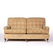 In the Manner of George Smith Two seater sofa on mahogany supports with brass castors, 185cm across,