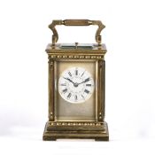 French repeater carriage clock with striking movement, enamel dial and Roman numerals, in a fluted