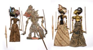 Javanese leather shadow puppet 81cm, and three painted wooden Javanese puppets, 53cm - 69cm, (4)