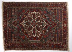 Hamadan blue ground rug with central foliate shaped medallion, and red ground foliate border 194cm x
