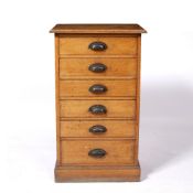 Set of six graduated drawers with brass handles on plinth base, oak, 48cm wide x 82cm high x 34cm