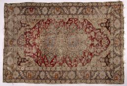 Persian red ground rug with central foliate medallion and banded border, 123cm x 82cm
