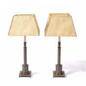 Pair of brass table lamps of column form with square bases, and matching parchment type shades, 67cm