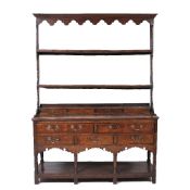 Oak dresser George III, with open top shelves and drawers to the base, on stile feet, 133cm wide x