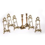 Pair of brass candlesticks 19th Century, 24cm and five gilt metal stands (7)