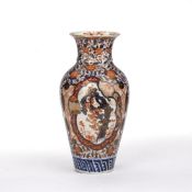 Imari vase Japanese, of baluster form, decorated to the body with flowering trees and rock work,