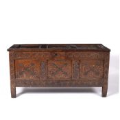 Carved oak coffer 18th Century, with three panelled top and sides, standing on stile feet, 127cm x