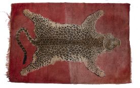 20th Century woven leopard skin rug, with fringed edges, 171cm x 117cm