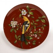 Minton Aesthetic movement Pottery charger decorated with a bird amongst branches, with Mintons and