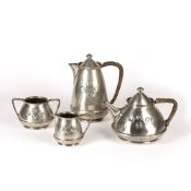Arts and Crafts pewter coffee set, each piece decorated with four roundel's, the tea and coffee