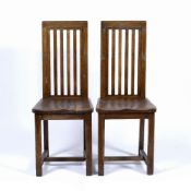 In the manner of Liberty & Co Pair of oak high back chairs, 95cm high (2)