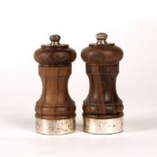Pair of silver mounted salt and pepper grinders with turned lignum vitae bodies, bearing marks for