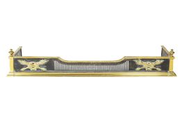 Brass and steel fender Edwardian, with trophy designs to the front, 128.5cm wide, 34cm deep