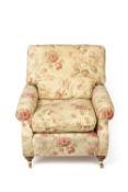 Contemporary armchair on brass castors, 80cm wide, 90cm high Condition: some wear to the arms