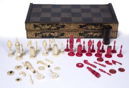 Export lacquer games box Chinese, late 19th Century, with a set of Canton carved and stained ivory