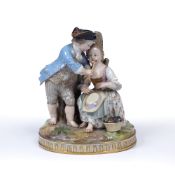 Meissen figural group of two children with blue cross swords marks on an oval base, 15cm high