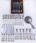 Collection of silver cutlery to include: set of six Victorian silver forks with engraved castle