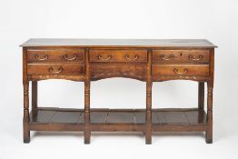 Oak dresser base 18th Century, fitted drawers with brass handles and with pot board below, 165cm