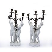 Pair of biscuit/parian ware and brass candelabra late 19th Century, with three scrolling acanthus