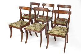 Set of six mahogany dining chairs 19th Century, each with anthemion carved backs on sabre legs and