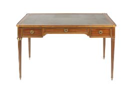 Mahogany French style writing table with brass mounts having three drawers on fluted supports, dummy
