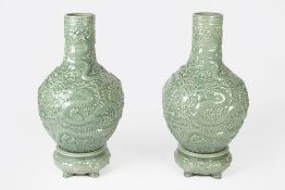 Pair of green ground floor standing bottle vases Chinese, each with dragon designs having Greek