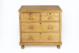 Pine chest of drawers on bun feet, 88cm wide, 44cm deep, 85cm high Condition: overall wear, marks,