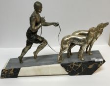An Art Deco design silvered and patinated figure group as 