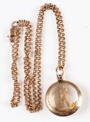 9ct gold Golf Pendant and yellow metal chain – glass and 9ct gold pendant featuring a golfer stamped