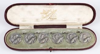 Cased Set of 6 Silver Golf Buttons each having golfer and club bag design with ring backs, each