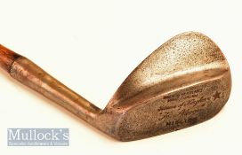 Fine Gibson of Kinghorn ‘Skoogee’ wide soled concave faced niblick fitted with a full length grip,