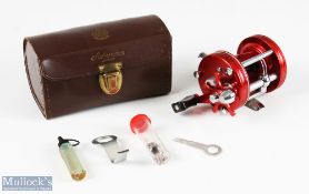 ABU Ambassadeur 6000 multiplier reel stamped 057009 finished in red, counter balance handle, on/
