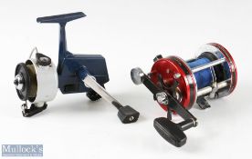 ABU Ambassadeur 7000 multiplier reel in red, stamped 910504 to foot, appears with line, signs of use