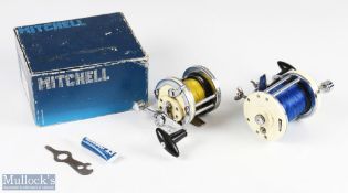 Mitchell 600 multiplier salt water reel with white end plates and chrome construction, with rod