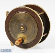 Prickman of Exeter 4” brass and ebonite reel having German silver rims, smooth brass foot, makers