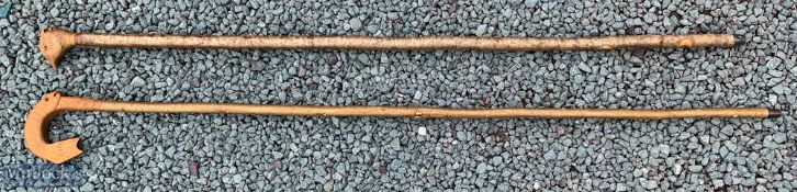 2 Animal Carved Crooks / Walking Poles one with fish design, the other with bird head, longest