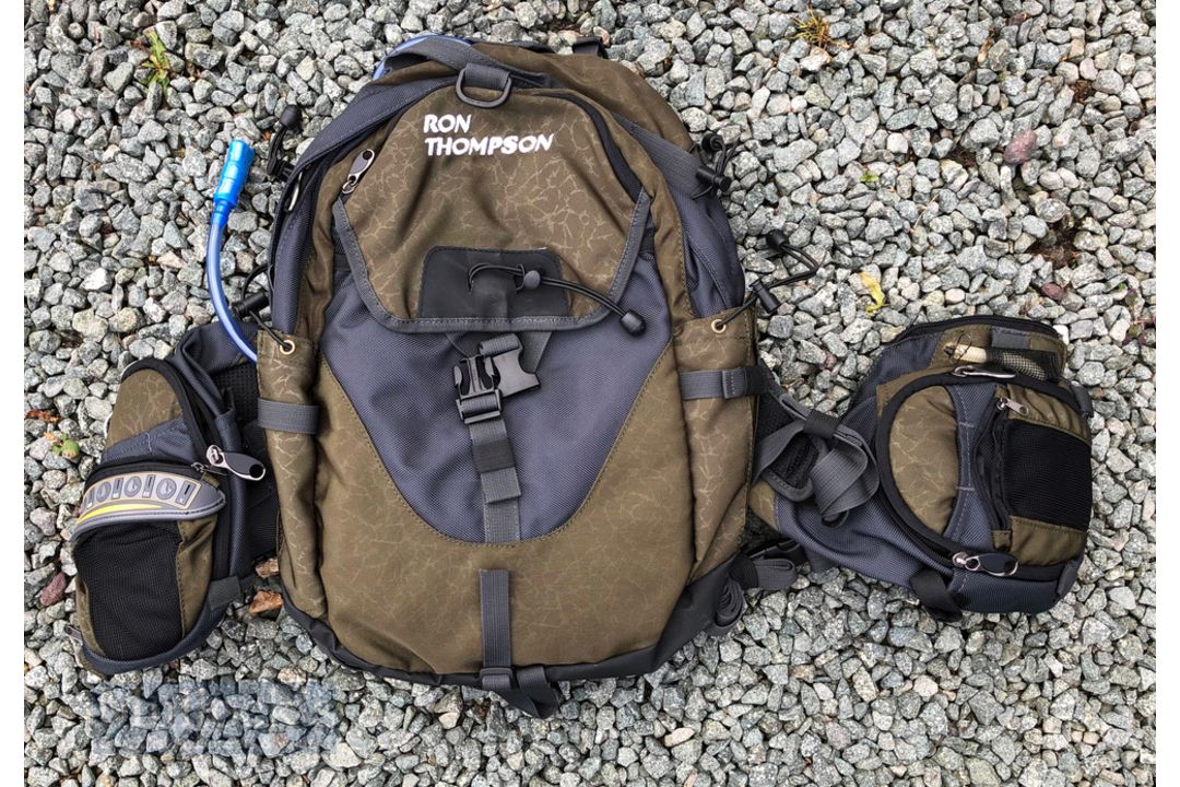 Ron Thompson Hydration Backpack Bag with water bladder compartment for drinking, with several zip